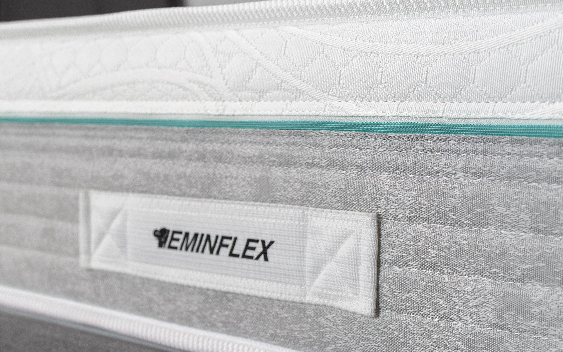 Eminflex Materassi Union matrimoniale dettaglio fascia con maniglia in tessuto